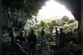 Students exploring a cave