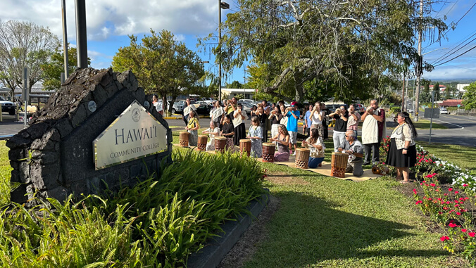 Traditional Kīpaepae (welcoming ceremony) in front of the campus sign at the entrance of the college.