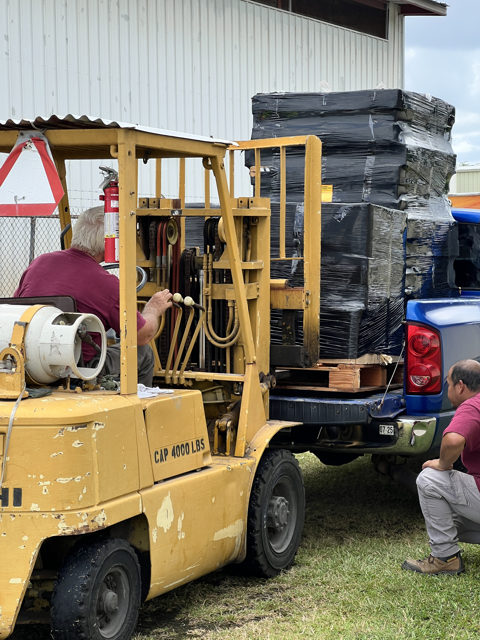 staff member driving loader