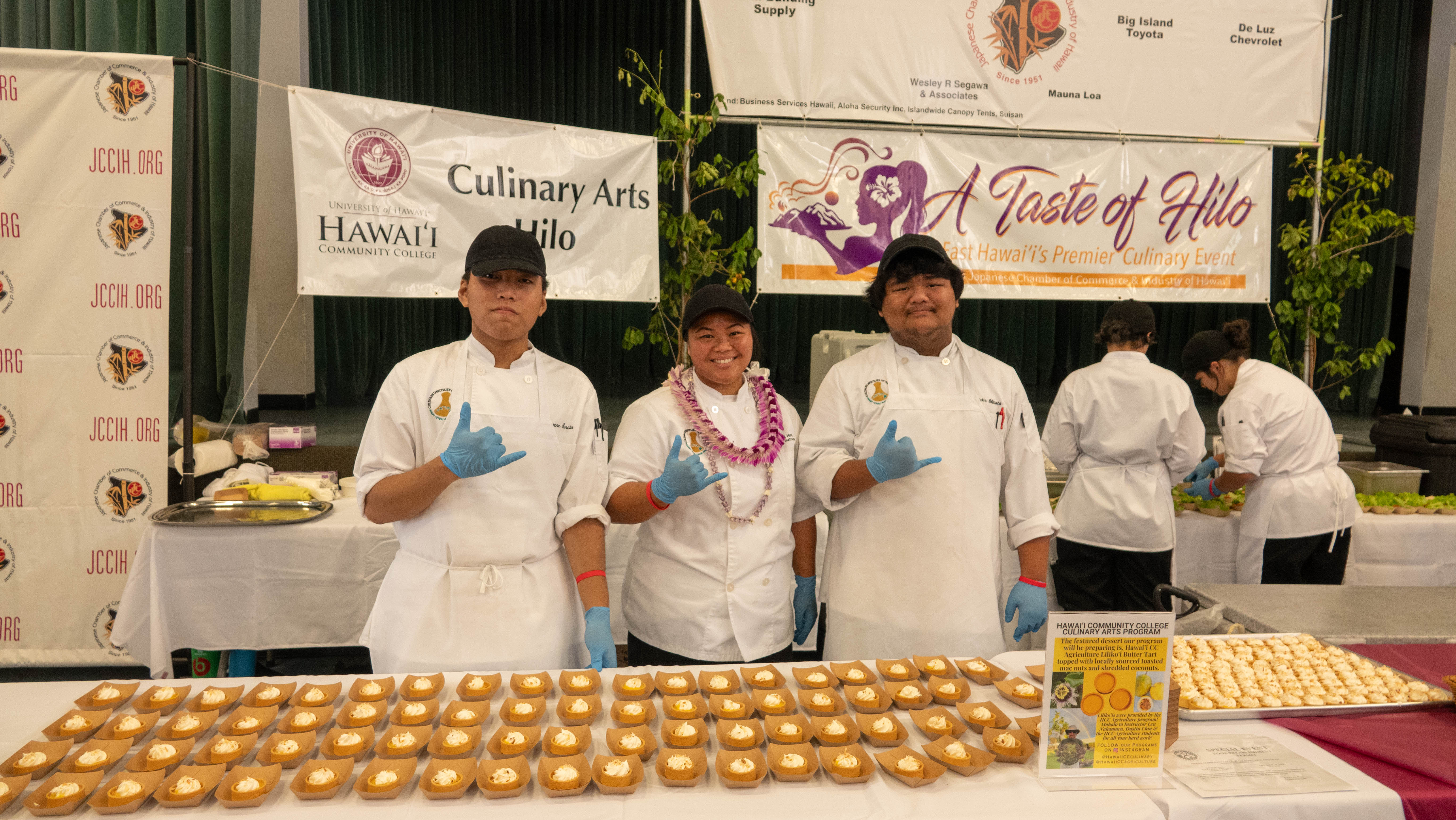 Hawai'i  CC Culinary Program students Shingene Garcia (left) and Alexander Shirota (right) with chef Tori Hiro