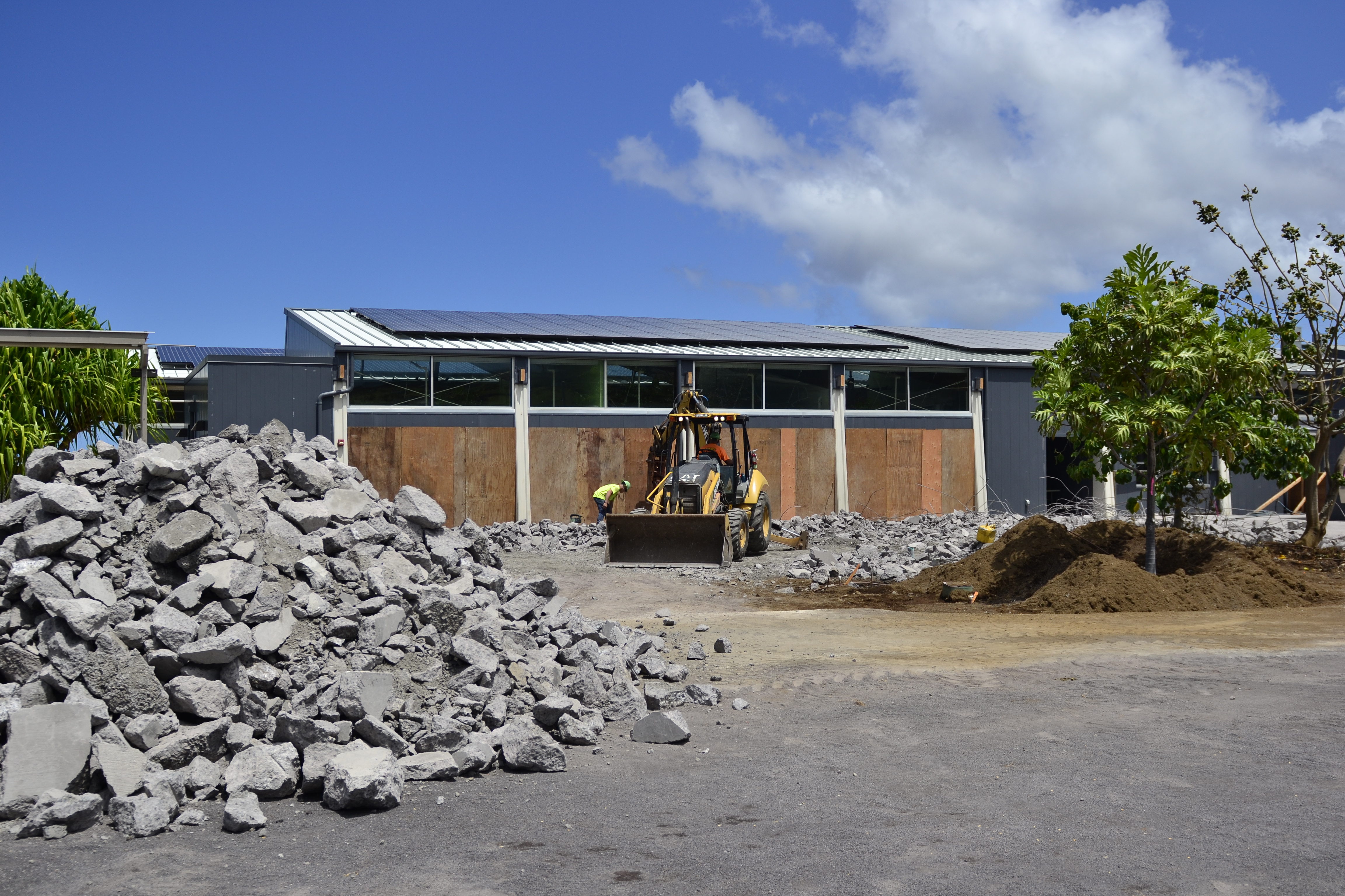 Construction workers at work on a project in April 2021 to create a large lanai area that will be a multi-functional space when it's complete next year. 