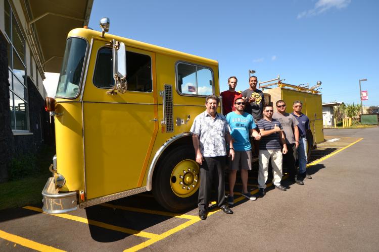 Students in the Fire Science and Diesel Mechanics programs posing by fire truck