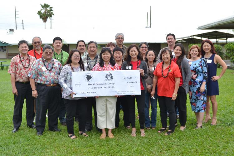 Group photo with Japanese Chamber of Commerce and Industry and check