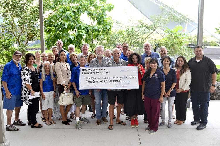 Group photo with big check