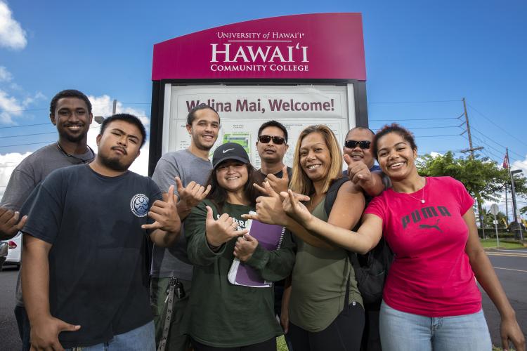 Students in front of signage