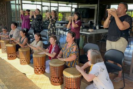 President Hensel takes part in a workshop exploring the elements of the Kīpaepae ceremony. During the session, she learned to hoʻokani the pahu (to drum) and pū (blow the conch shell), discovering the meaning behind this tradition.