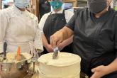 Maria Short, owner of Short N Sweet Bakery in Hilo, gives a demonstration to Hawaii Community College Culinary Arts students Sydirah Aricayos, left, and Ka’io Nagui. 