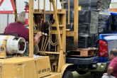 staff member driving loader