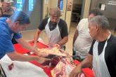 Instructor Bill Wong teaches Hawai‘i Community College butchery students proper beef cutting techniques. (Photo Credit: Hawai‘i CC)