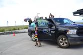 photo of graduate exiting car